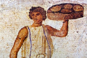 Un servitore dell'Antica Roma serve il cibo in tavola
